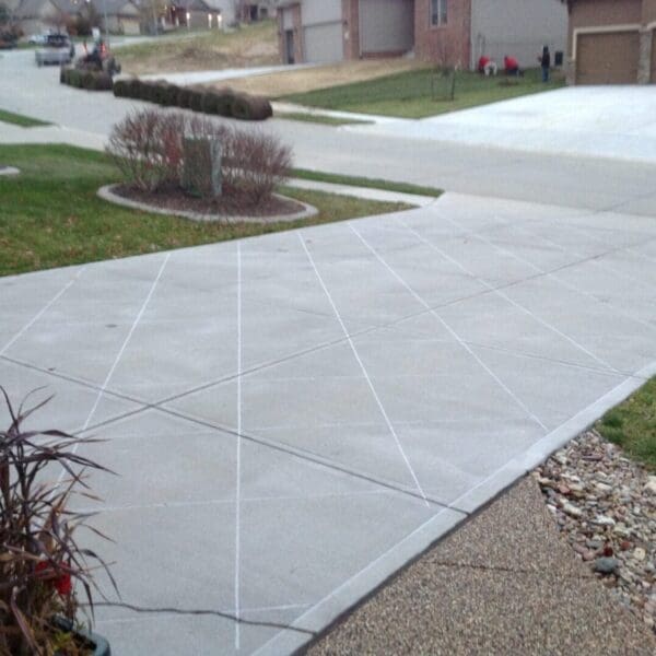 A driveway with a white line on the side of it.