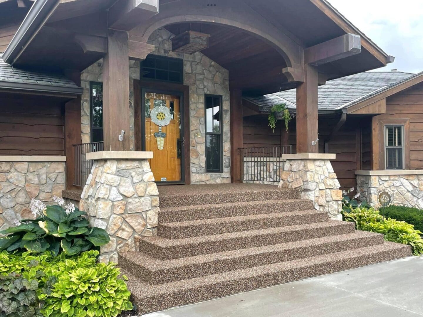 A house with steps leading to the front door.